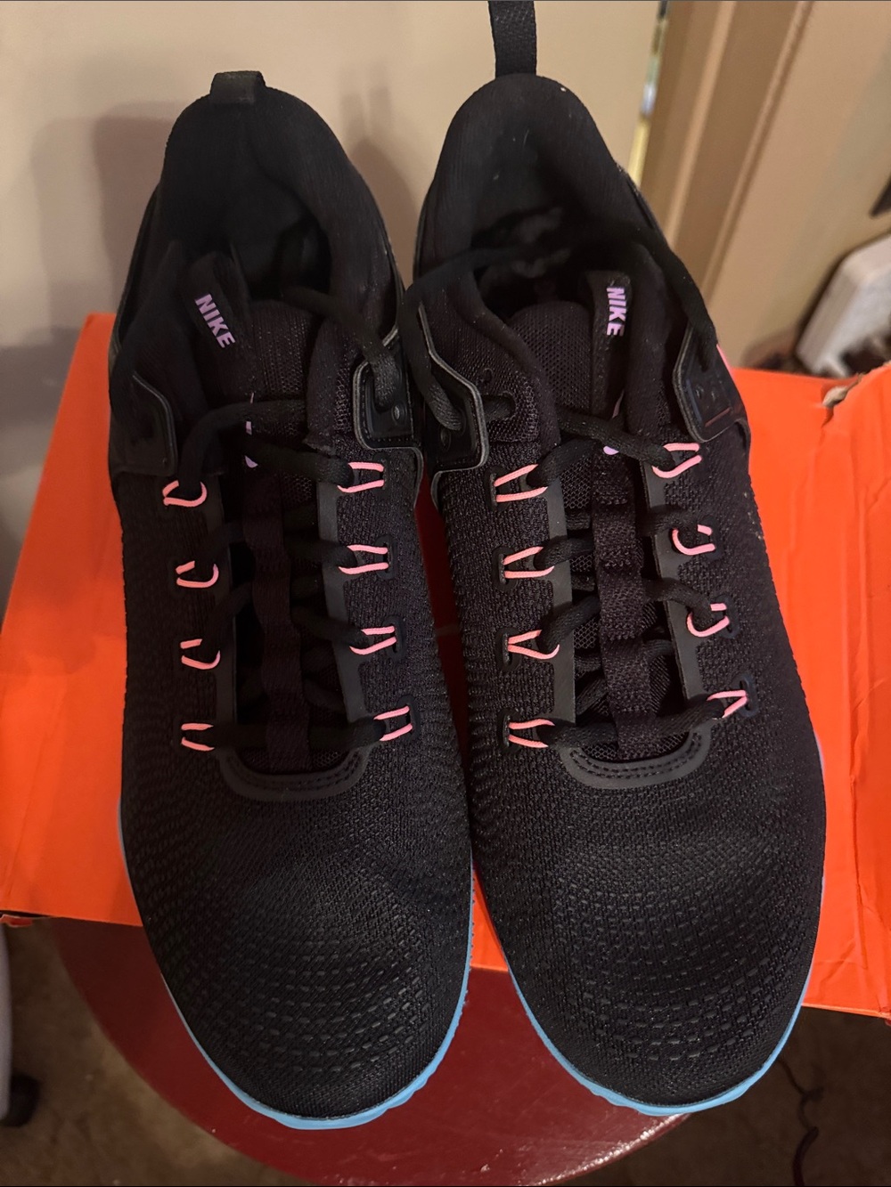 Nike Black Running Sneakers with Pink Accents and Blue Outsole